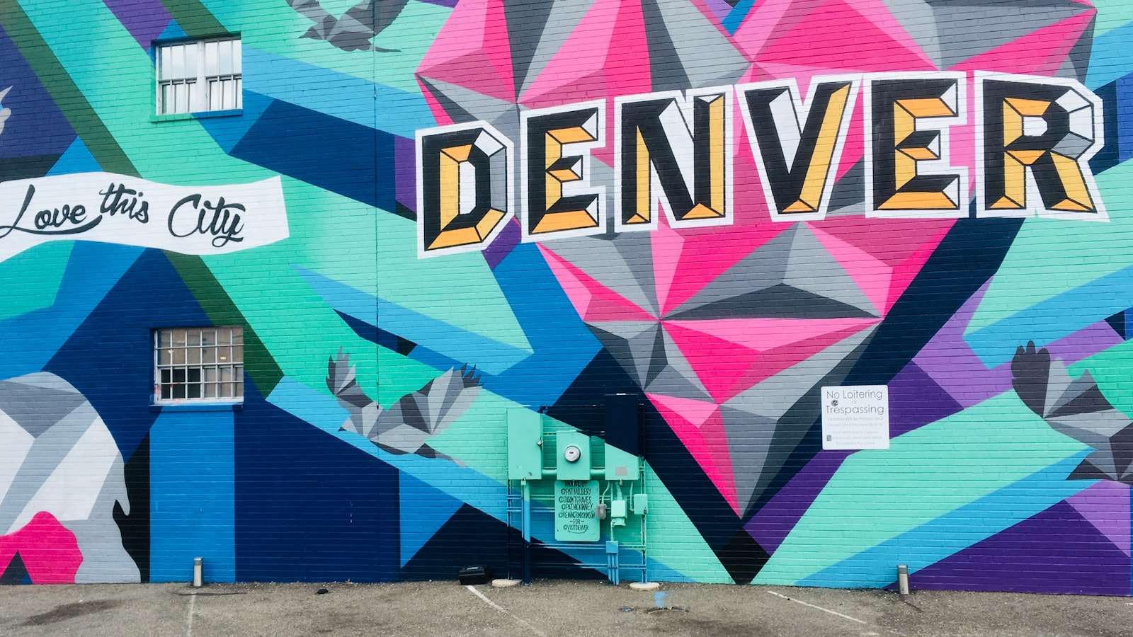 Colorful Denver street-art mural reading 'Love This City'