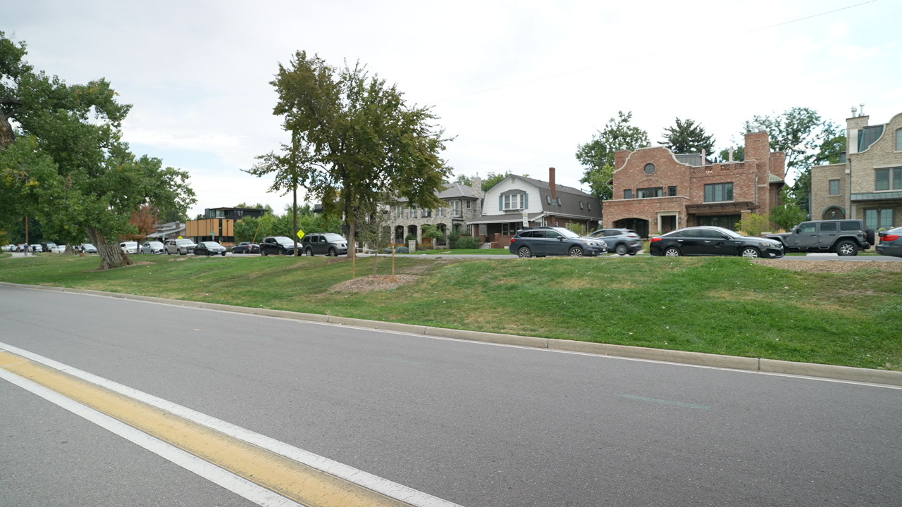 Wide view of upscale homes along a Wash Park residential street, Denver